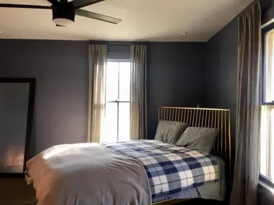 a bedroom with a bed and a ceiling fan at Zen in Narrowsburg Retreat near Town in Narrowsburg