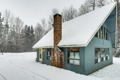 a green house with a snow covered roof at Ski, Hike and More! Year-Round Retreat in West Dover in West Dover