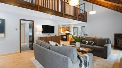 a living room with two couches and a tv at Catskills Mountain Home Near Windham w Fireplace Open Living Deer Run Lodge by AvantStay in Prattsville