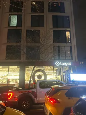 a truck parked in front of a building at night at Minimalist Midtown West Studio in Central Manhattan in New York