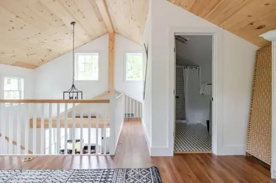 a room with white walls and a wooden ceiling at Berkshire House in Hillsdale