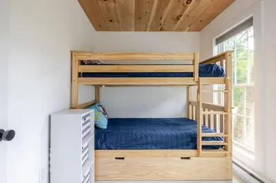 a bedroom with bunk beds in a tiny house at Berkshire House in Hillsdale