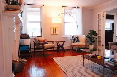 a living room with a table and chairs at Hot Tub, 2 Blocks to Downtown Saugerties, Sleeps 8 in Saugerties