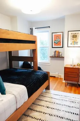 a bedroom with a bunk bed and a window at Hot Tub, 2 Blocks to Downtown Saugerties, Sleeps 8 in Saugerties