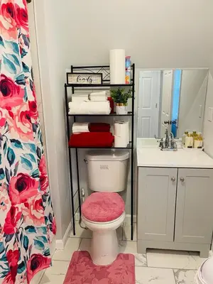 a bathroom with a toilet and a sink at Xceptional homes in East Orange