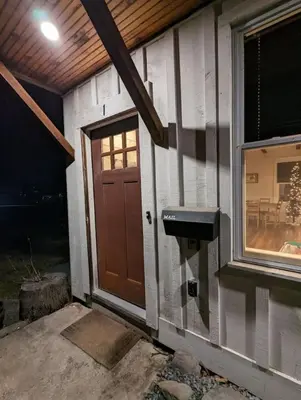 a small house with a door and a window at Carriage House Apartment Close to Legoland NY in Goshen