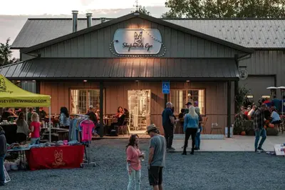 a group of people standing outside of a store at Hay Loft in Historic Barn - 4 Minutes to Legoland in Goshen