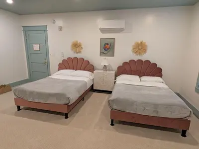 two beds in a room with two beds sidx sidx sidx sidx at Parkway House Goshen Bed And Breakfast Suite 1 in Goshen