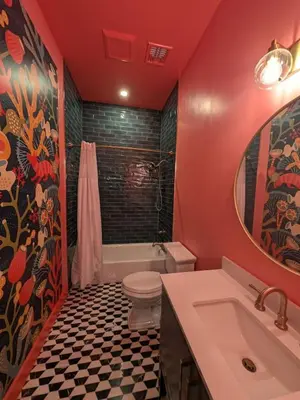 a bathroom with a toilet and a tub and a sink at Parkway House Goshen Bed And Breakfast Suite 5 in Goshen