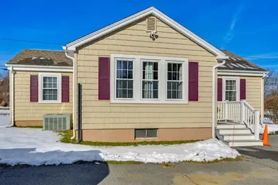 a yellow house with red shutters on it at Heart of Five College Consortium! Hadley Home in Hadley