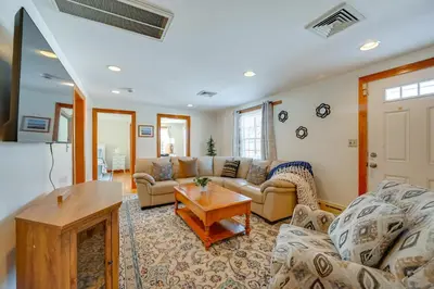 a living room with a couch and a table at Heart of Five College Consortium! Hadley Home in Hadley