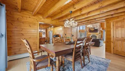 a dining room with a wooden table and chairs at Amazing Views Hot Tub Fire Pit Game Room in Ashland