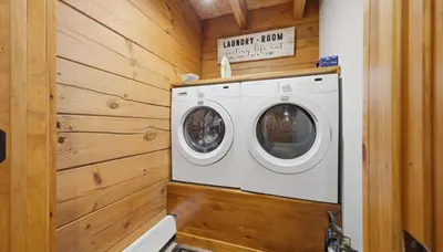 a washer and dryer in a tiny house at Amazing Views Hot Tub Fire Pit Game Room in Ashland