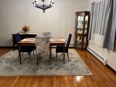 a dining room table with chairs and a chandelier at Perfect Family Retreat in East Haven in East Haven