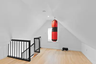 a red and black punching bag hanging on a wall at 17m to NYC,5 min to American Dream,2Parking Spaces in Carlstadt