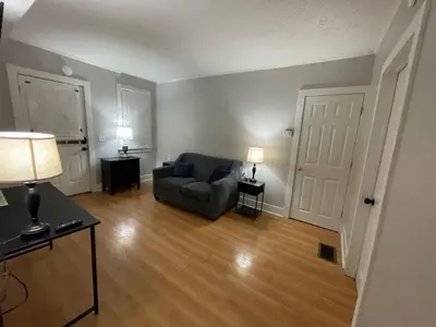 a living room with a couch and a table at Beach Apartment in Woodmont Milford 102 in Milford