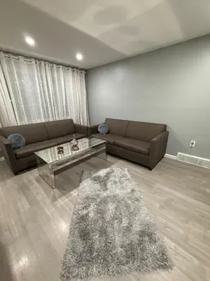 a living room with two couches and a table at Barnes Avenue near Yale in New Haven