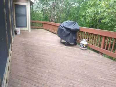 a porch with a black umbrella on a deck at Cozy 4bd 4bath Grand Cabin Retreat in Camelback in Tannersville