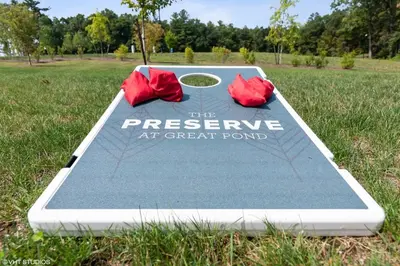 a sign that says the preserve at great pond in a field at Landing Apartments - The Preserve at Great Pond in Windsor