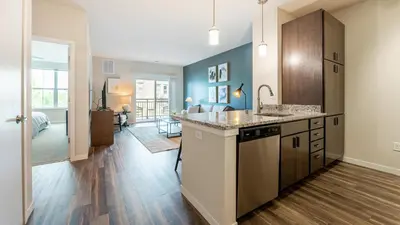 a kitchen with a sink and a counter top at Landing Apartments - The Preserve at Great Pond in Windsor