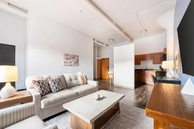 a living room with a couch and a table at Landing Stylish 1BD Courtyard in Springfield