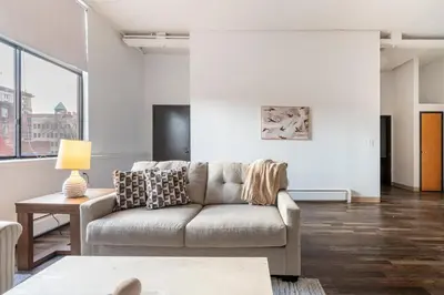 a living room with a couch and a table at Landing Stylish 1BD Courtyard in Springfield