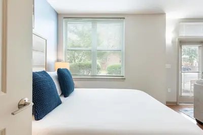 a bedroom with a white bed and a window at Landing Beautiful Studio in South End Stratford in Stratford