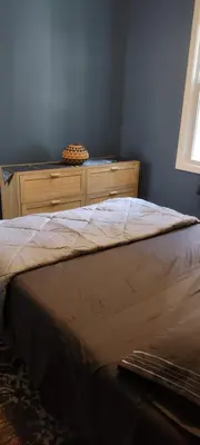a bed in a bedroom with a dresser and a window at Fill Your Headspace with Tranquility Near NYC in Maplewood