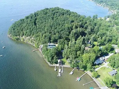 an aerial view of an island in a body of water at Saratoga Lake Boathouse Retreat in Saratoga Springs