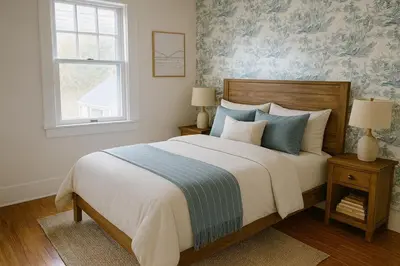 a bedroom with a large bed and a window at The Saratoga Beachhouse in Saratoga Springs
