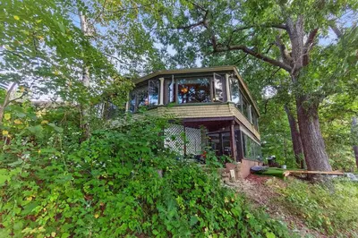 a tree house in the middle of a forest at Governors Mansion on the Hudson - Saratoga Riverside Estate in Greenwich