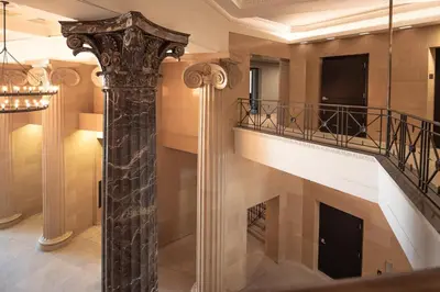 a spiral staircase in a building with a column at Landing Beautiful 1BD Gym in Hartford