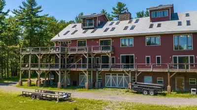a large red house with a gambrel roof at Moonrise Rest A Historic Mohawk Valley Retreat in Schenectady