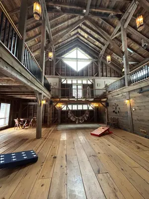 a large room with wooden floors and a large ceiling at Moonrise Rest A Historic Mohawk Valley Retreat in Schenectady