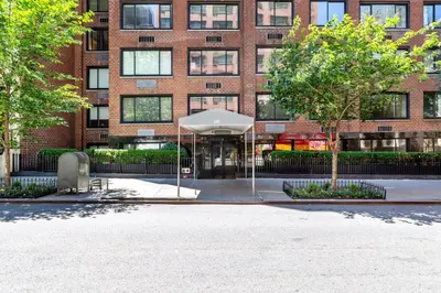 a building with a white umbrella in front of it at Blueground Midtown East fitness center nr UN NYC-2172 in New York