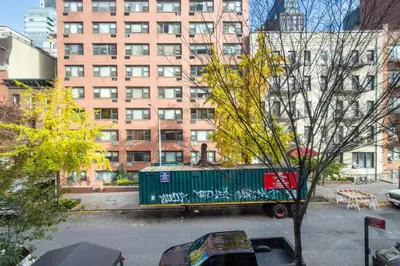 a truck parked in a parking lot in a city at Blueground Midtown East fitness center nr UN NYC-2172 in New York