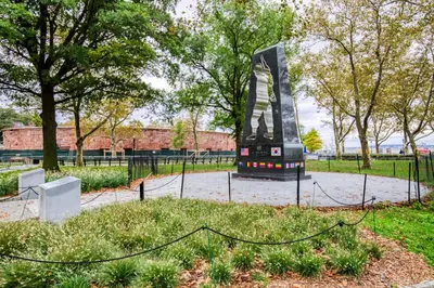 a sculpture in a park with trees and a fence at Blueground Financial District rooftop nr Brooklyn Bridge NYC-2201 in New York