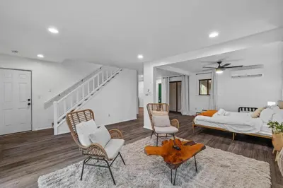 a living room with a bed and a couch at Pocono Serenity Retreat | 3-BR w/ Bonus King Suite & Hot Tub by Stay Lage in East Stroudsburg