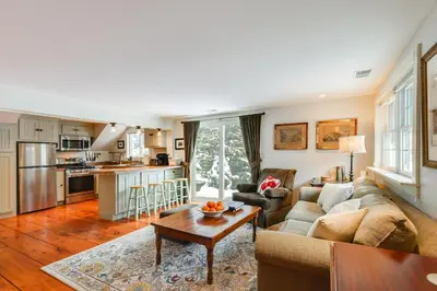 a living room with a couch and a table at Hike, Fish, Hunt! Green Mountain Home By River