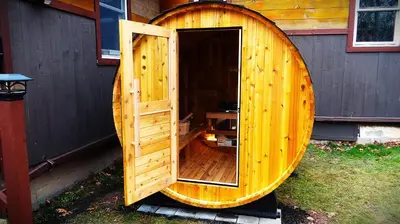 a wooden hobbit house with an open door at Villa Gran Sasso in Hunter