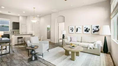 a living room with a couch and a table at Landing Apartments - The Preserve at Great Pond in Windsor