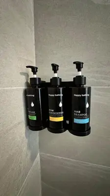 two bottles ofodorizers are hanging on a wall at Cozy Stay with Games, 15 min to NYC, Private Backyard - Sleeps 6 - NEAR METLIFE STADIUM in Jersey City