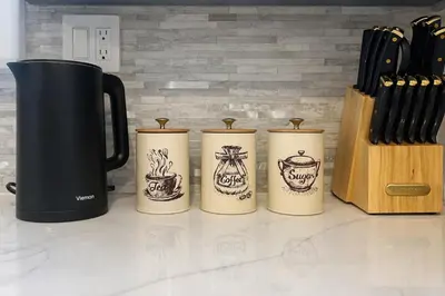 a group of four coffee mugs sitting on a counter at Cherry Blossom Lake House in Lake Peekskill