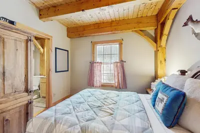 a bedroom with a bed and a window at Grouse Lane 12C in Dover