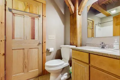 a bathroom with a toilet and a sink at Grouse Lane 12C in Dover