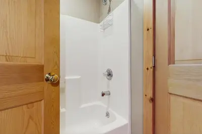 a bathroom with a shower and a sink at Grouse Lane 12C in Dover