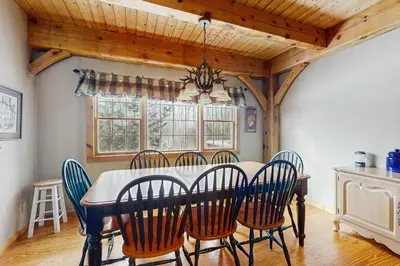a dining room with a table and chairs at Grouse Lane 12C in Dover