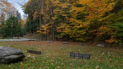 a park with benches in a field with trees at Luxe Lakefront Paradise! King Beds, Private Dock, Gourmet Kitchen, Theatre and Game Room!