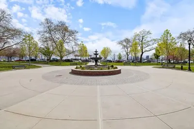 a fountain in the middle of a park at New Luxury and Chic 3BR 2BA Apartment 20 Minutes to NYC in Jersey City