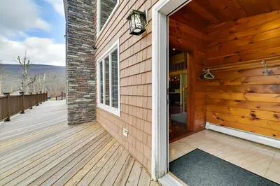 a front porch of a wooden house at Walk to Hunter Village! Family Ski Retreat with Deck in Lanesville